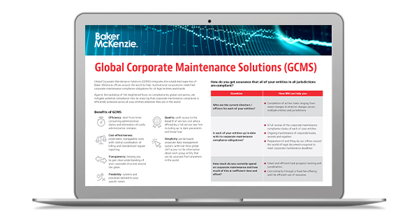 Laptop with Global Corporate Maintenance Solutions flyer on screen