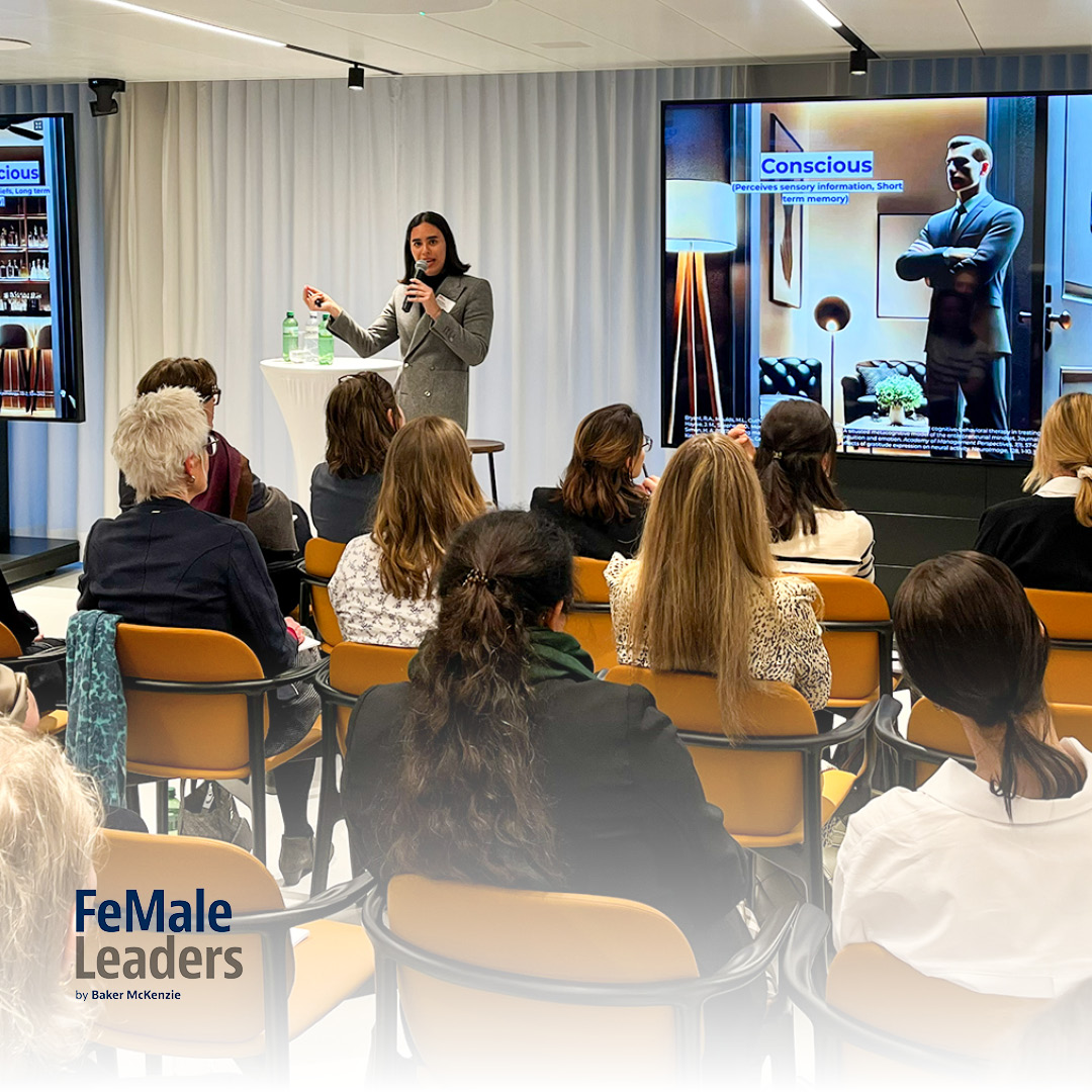 A woman speaking before an audience