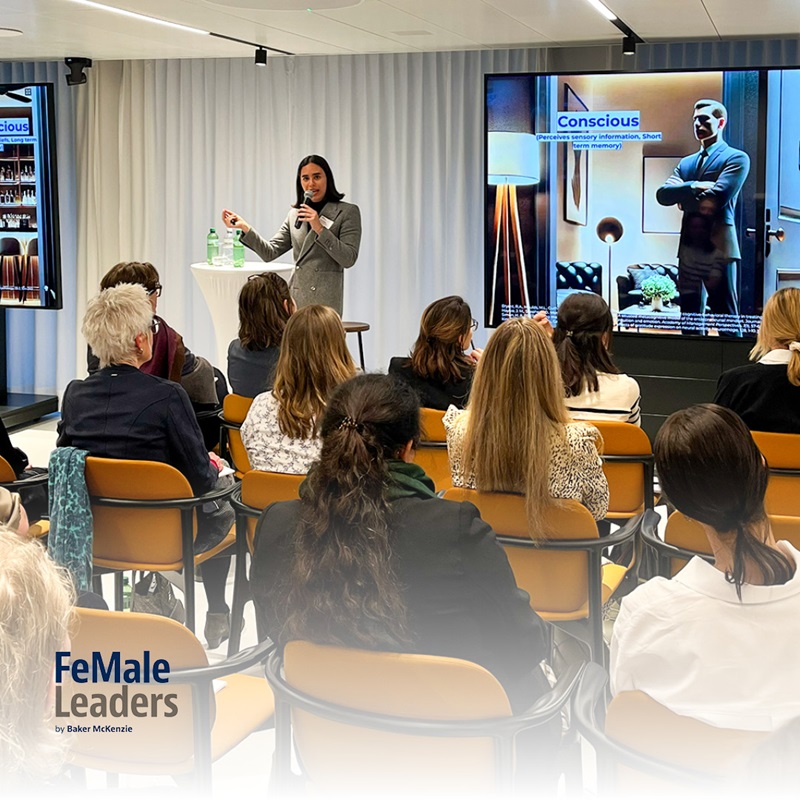 A woman speaking before an audience
