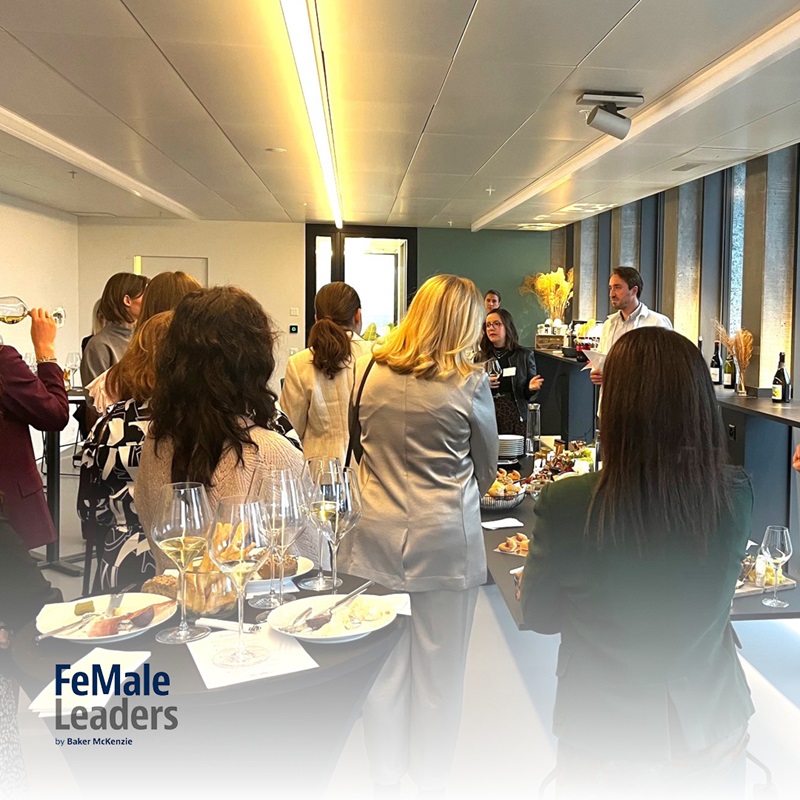 Guests listening to a speaker at the wine tasting event