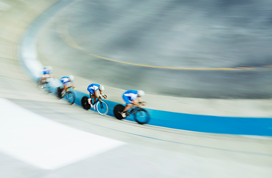 cyclists cycling motion blur blue curve abstract