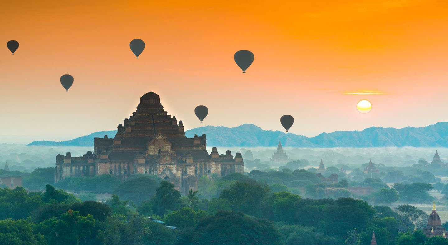 Hot air balloons above temple
