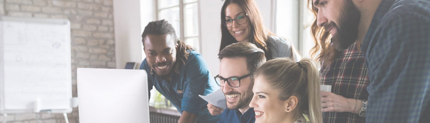 dynamic group of people around computer 